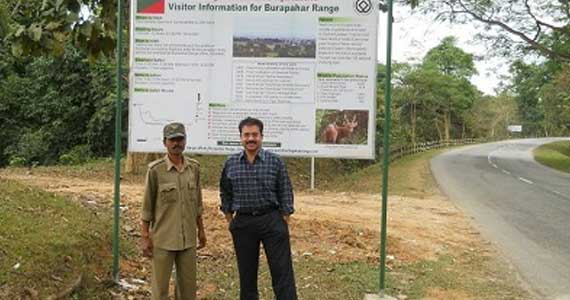 At the Kaziranga National Park with a forest guard. The NH 37 passes through the park and the journey thus comes out to be one of the most memorable.