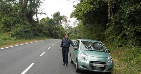 Susanto’s car and me smile emoticon....the forests all around.