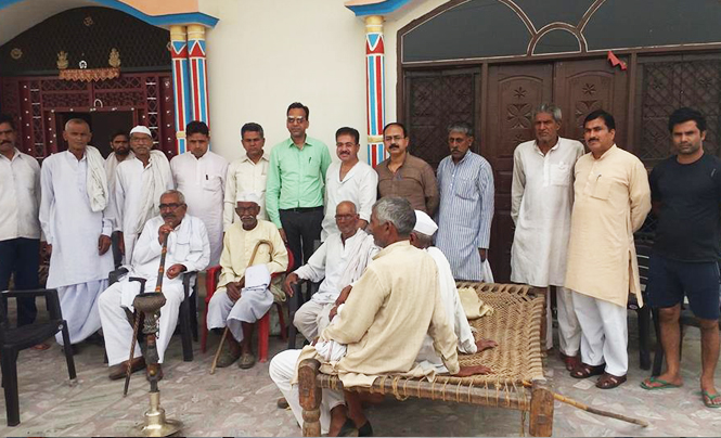With residents of the freedom struggle village of Budhera